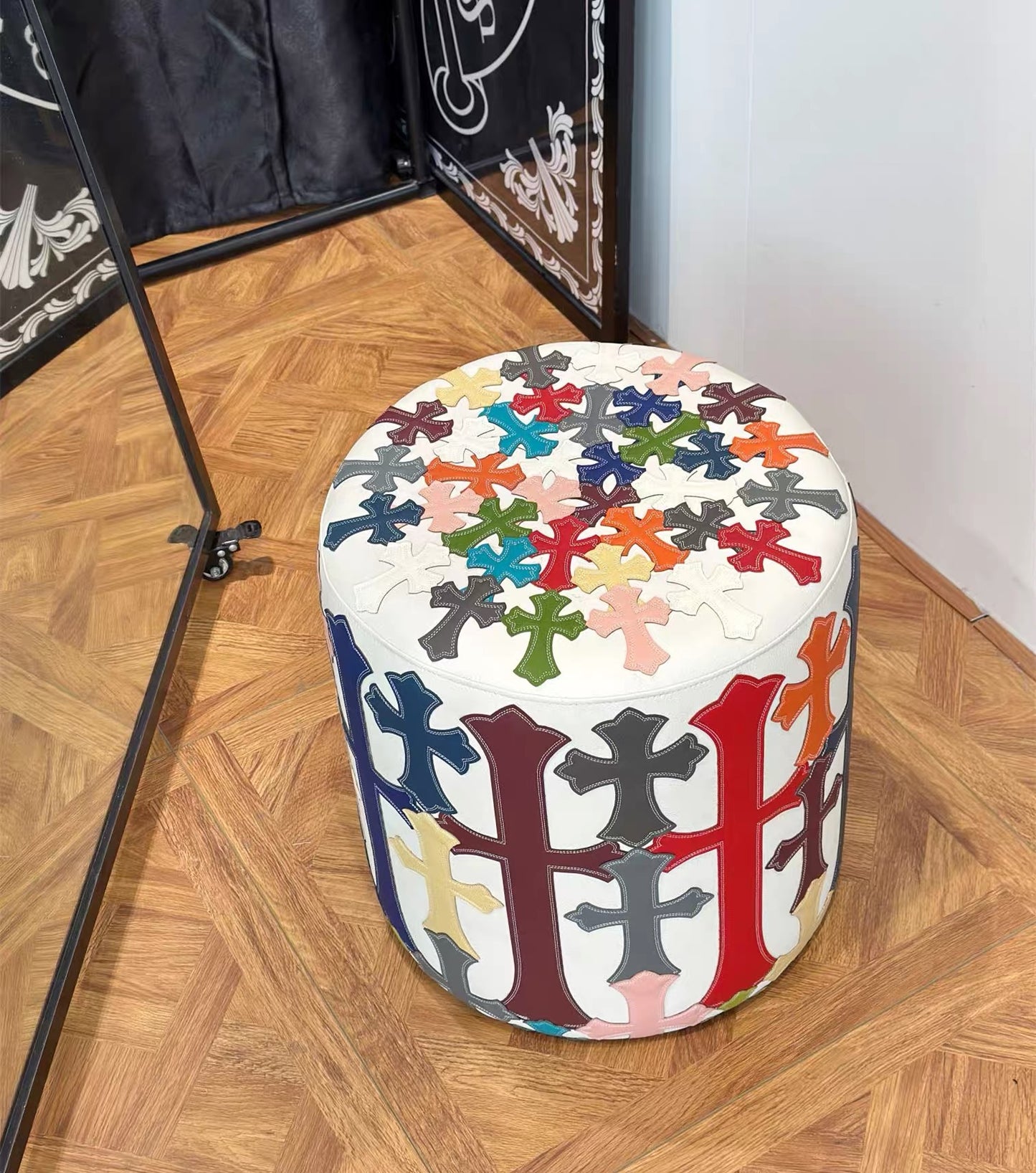 white matte chrome cross multi-color patches ottomon stool for furniture showroom.